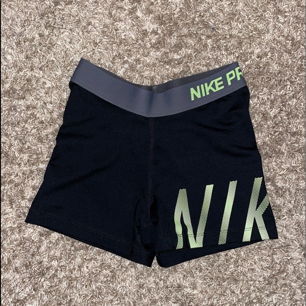 Black and neon Nike pros.